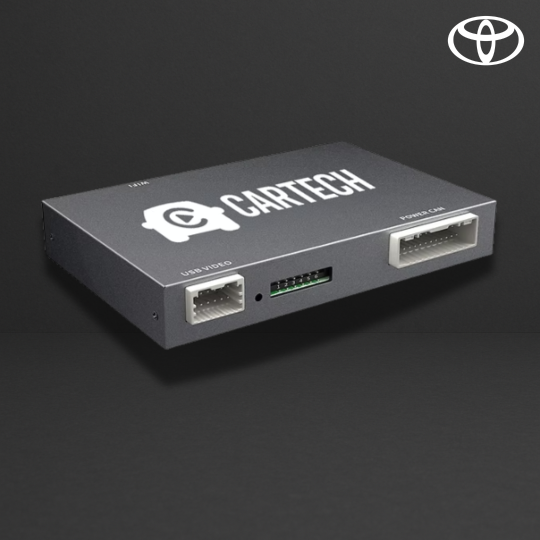 Boîtier électronique gris sombre avec connecteurs: USB video et port car, logo CartTech sur le dessus, logo Toyota en haut à droite.