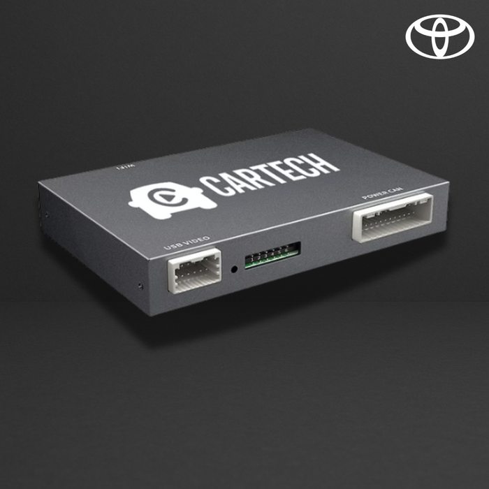 Boîtier électronique gris sombre avec connecteurs: USB video et port car, logo CartTech sur le dessus, logo Toyota en haut à droite.